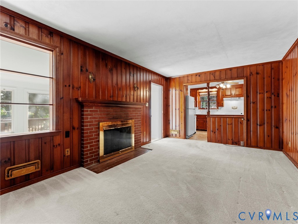 1803 Windsordale Drive Henrico, VA 23229 - Photo 24 of 46 Unfurnished living room featuring wood walls, ligh