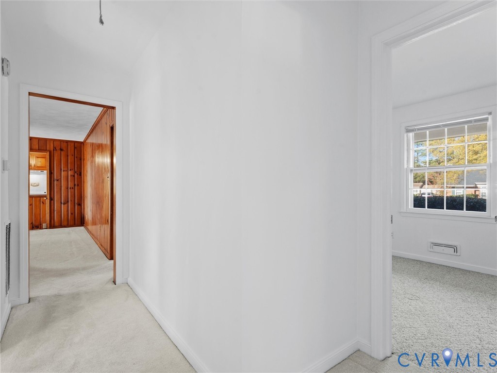 1803 Windsordale Drive Henrico, VA 23229 - Photo 28 of 46 Hall featuring light colored carpet and wooden wal