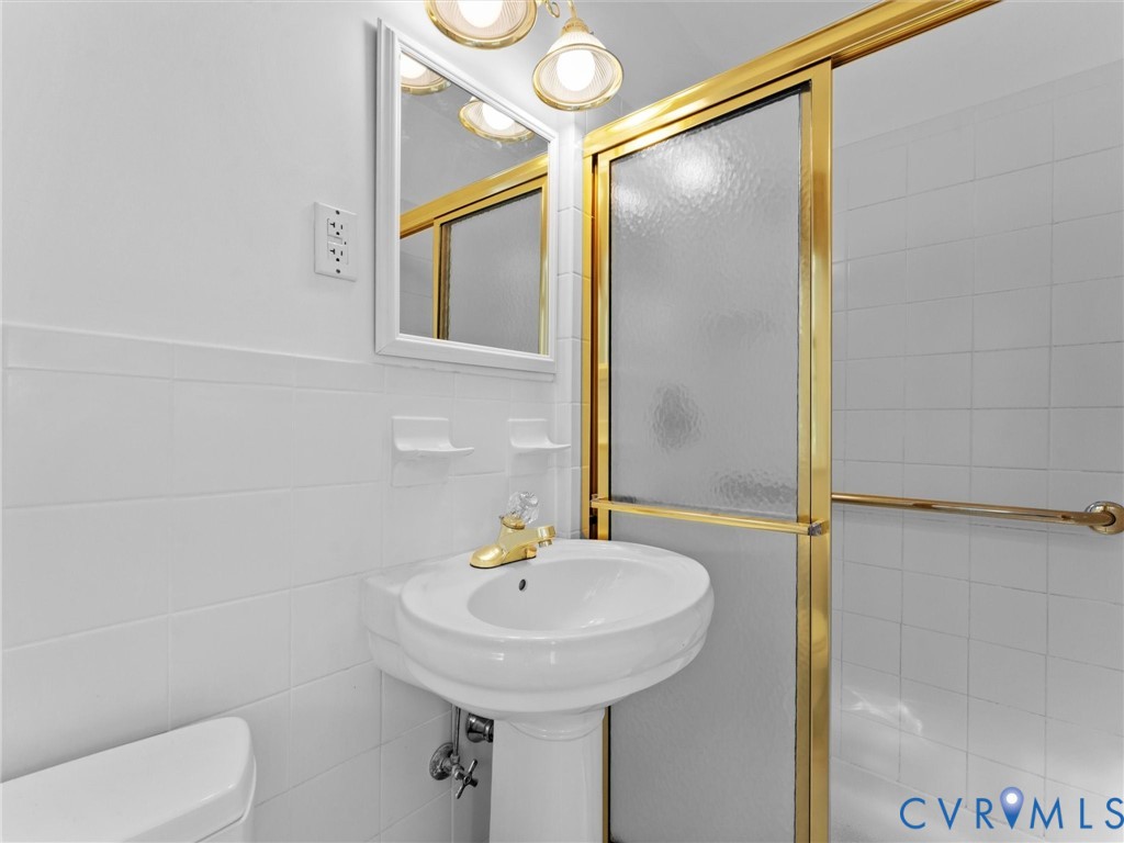 1803 Windsordale Drive Henrico, VA 23229 - Photo 36 of 46 Full bathroom featuring a stall shower and tile wa