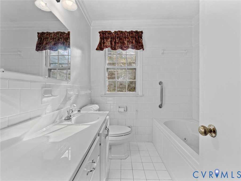 1803 Windsordale Drive Henrico, VA 23229 - Photo 37 of 46 Bathroom featuring tile walls, vanity, ornamental