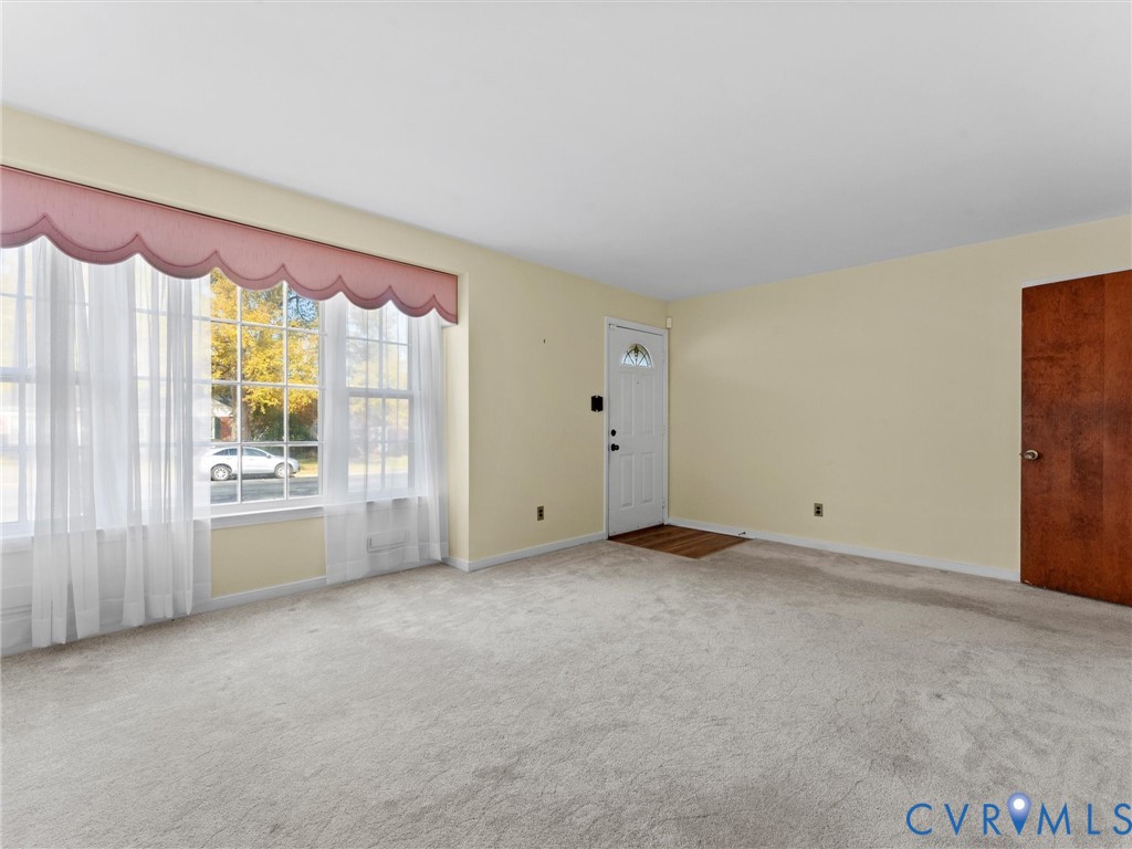 1803 Windsordale Drive Henrico, VA 23229 - Photo 8 of 46 Carpeted spare room with baseboards