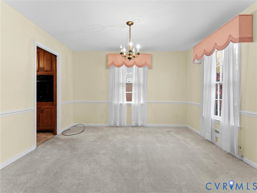 1803 Windsordale Drive Henrico, VA 23229 - Photo 9 of 46 Unfurnished dining area featuring carpet flooring,