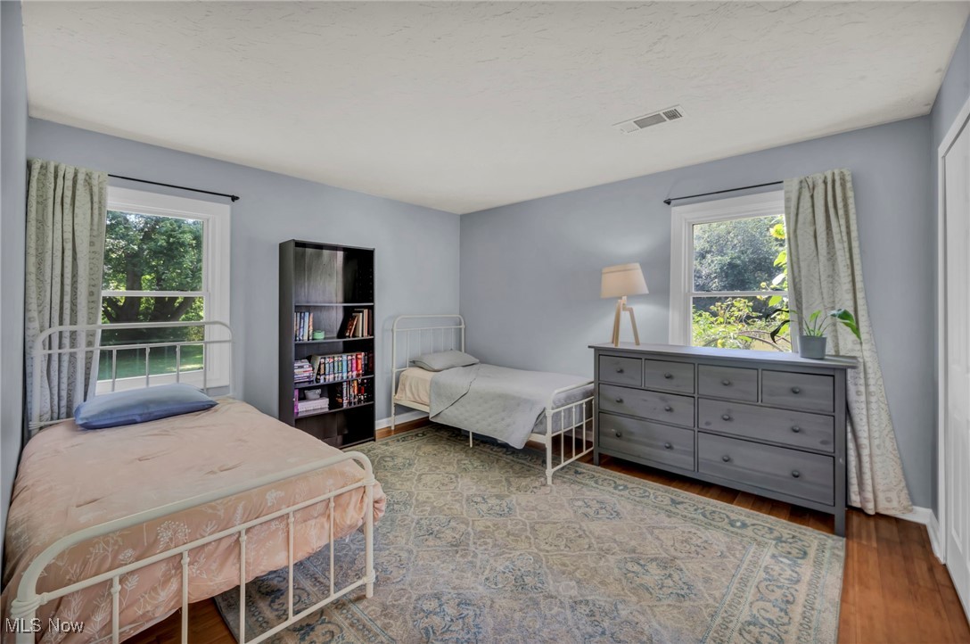 2264 Acre Road Akron, OH 44320 - Photo 23 of 47 Bedroom with bamboo finished floors and a textured ceiling