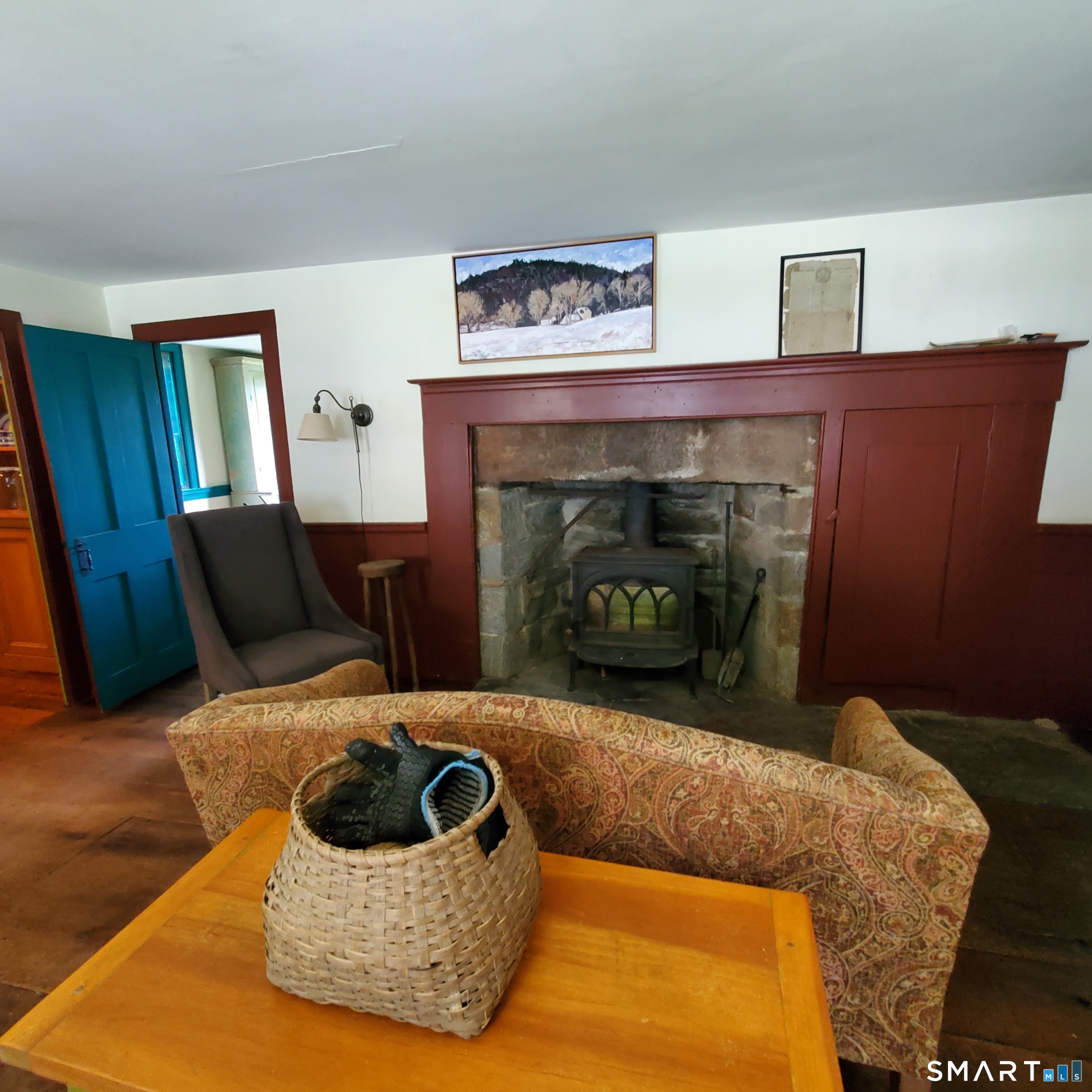 24 Ayer Road Franklin, CT 06254 - Photo 13 of 15 Living room with wide board floors and fireplace with woodstove insert.