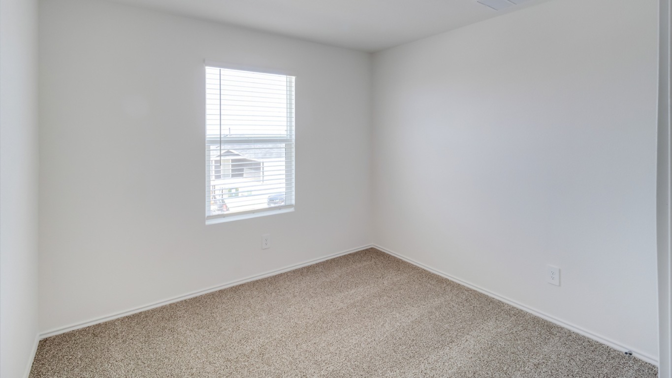 845 Arnold Loop Kyle, TX 78640 - Photo 14 of 17 an empty room with a window