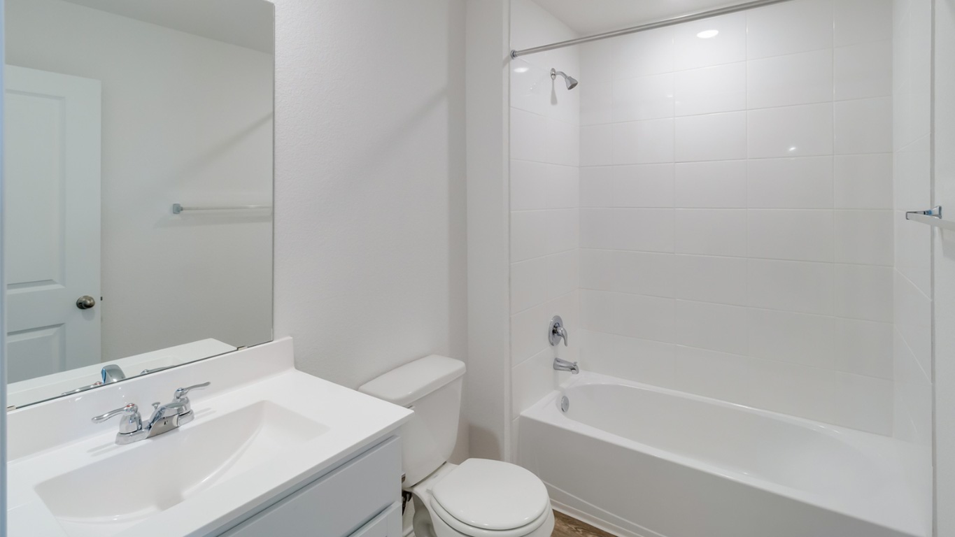 845 Arnold Loop Kyle, TX 78640 - Photo 15 of 17 a bathroom with a sink toilet and shower