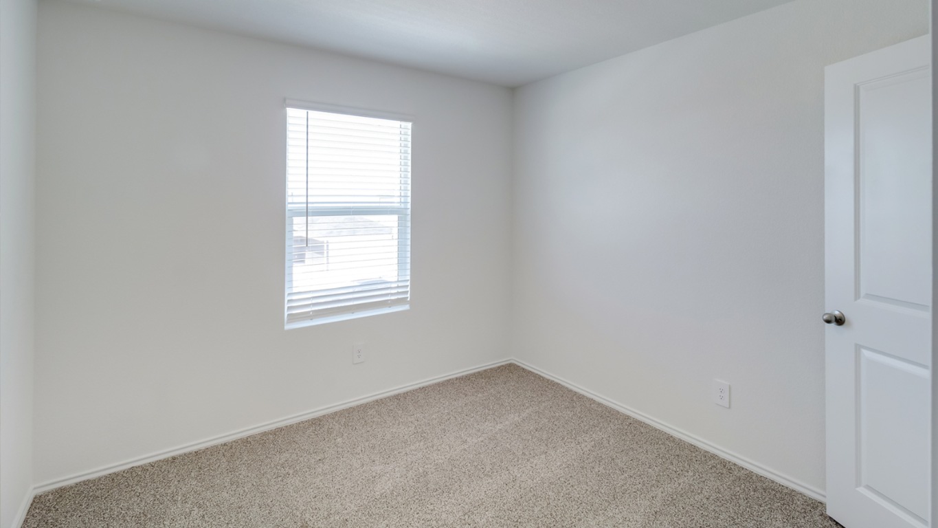 845 Arnold Loop Kyle, TX 78640 - Photo 16 of 17 an empty room with a window