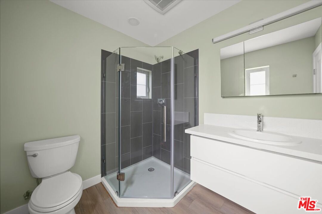 1317 Punta Gorda Street, Unit 4 Santa Barbara, CA 93103 - Photo 17 of 70 a bathroom with a sink toilet and shower