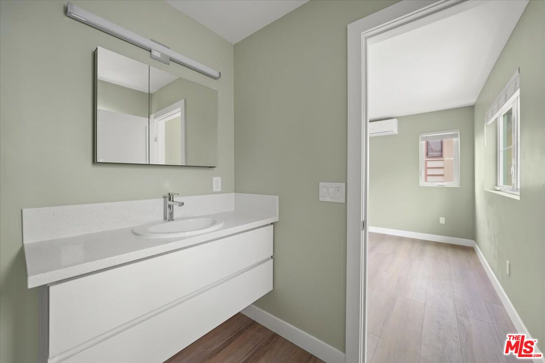 1317 Punta Gorda Street, Unit 4 Santa Barbara, CA 93103 - Photo 18 of 70 a bathroom with a sink and a mirror