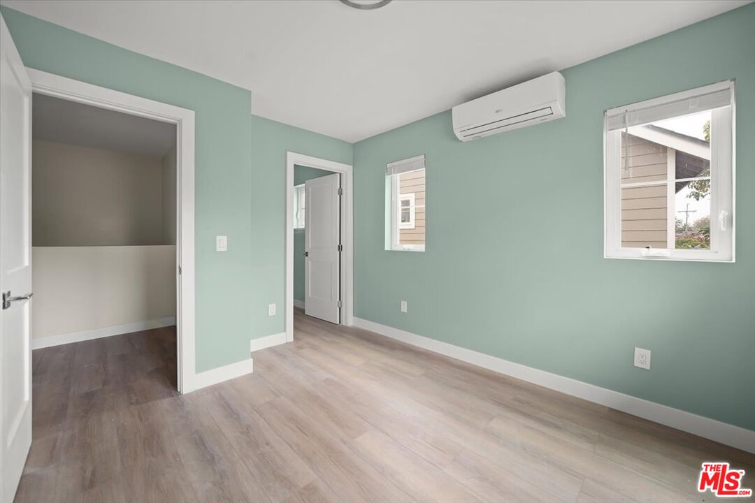 1317 Punta Gorda Street, Unit 4 Santa Barbara, CA 93103 - Photo 20 of 70 an empty room with wooden floor and windows