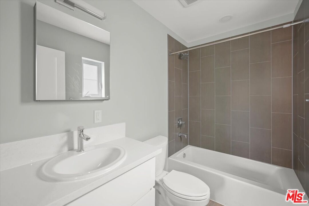 1317 Punta Gorda Street, Unit 4 Santa Barbara, CA 93103 - Photo 23 of 70 a bathroom with a sink toilet and shower