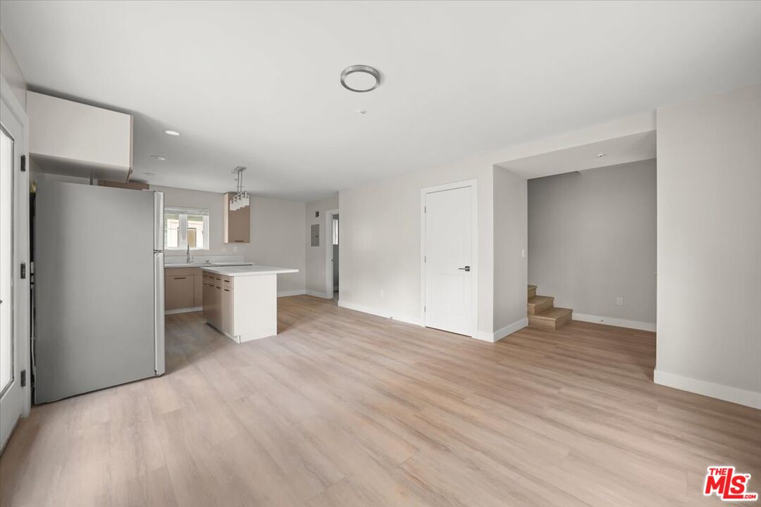 1317 Punta Gorda Street, Unit 4 Santa Barbara, CA 93103 - Photo 7 of 70 a view of a kitchen with wooden floor and windows