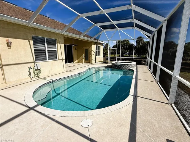 a view of a swimming pool with a lounge chairs