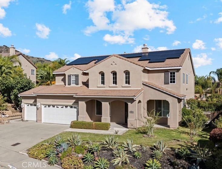 8634 Hunt Canyon Road Corona, CA 92883 - Photo 1 of 31 a view of white house with a big yard and potted plants