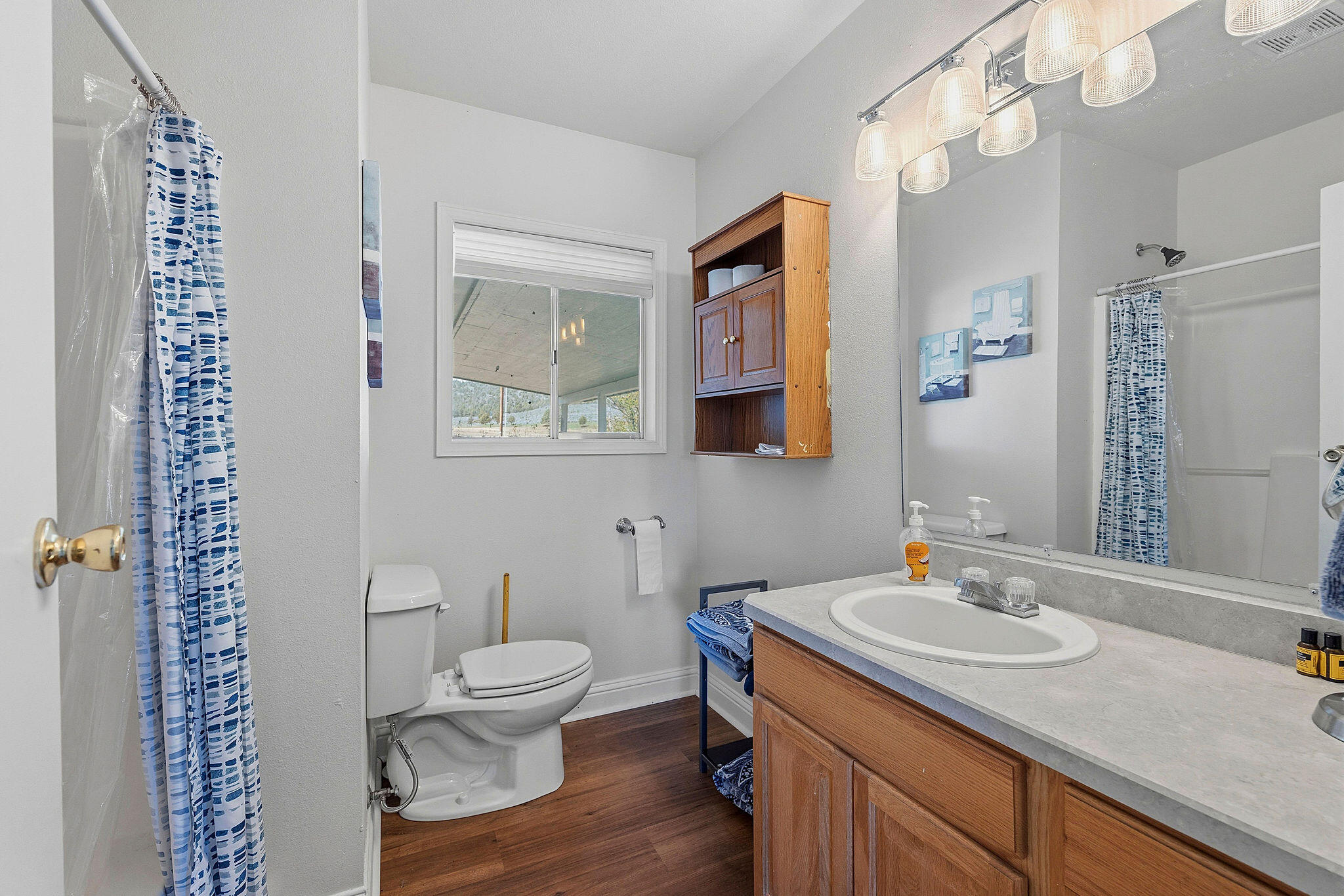 41221 Van Lake Road Prineville, OR 97754 - Photo 60 of 189 a bathroom with a sink a toilet and a mirror