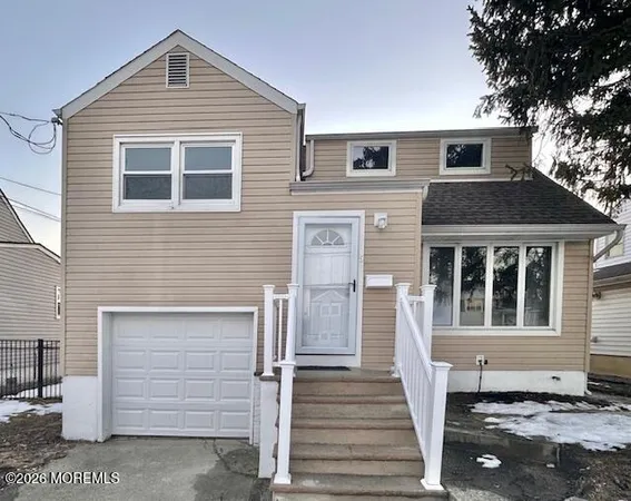a front view of a house with a garage