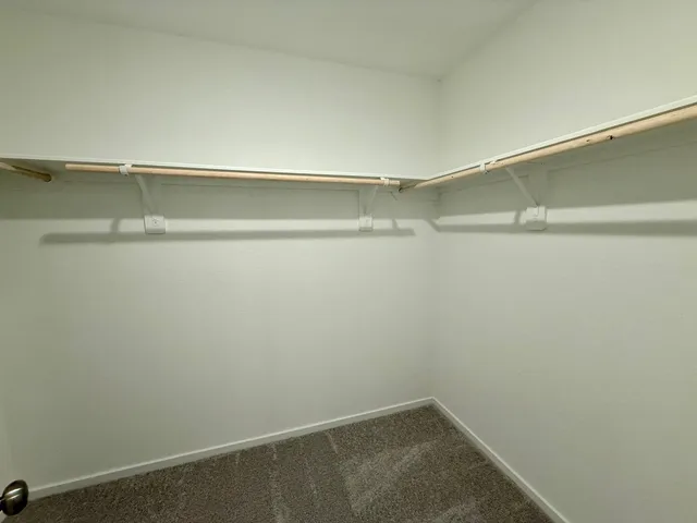 a view of an empty walk in closet