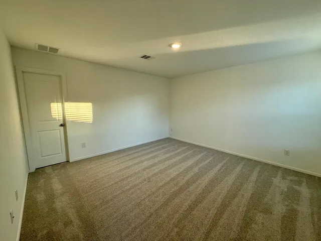 an empty room with a fireplace