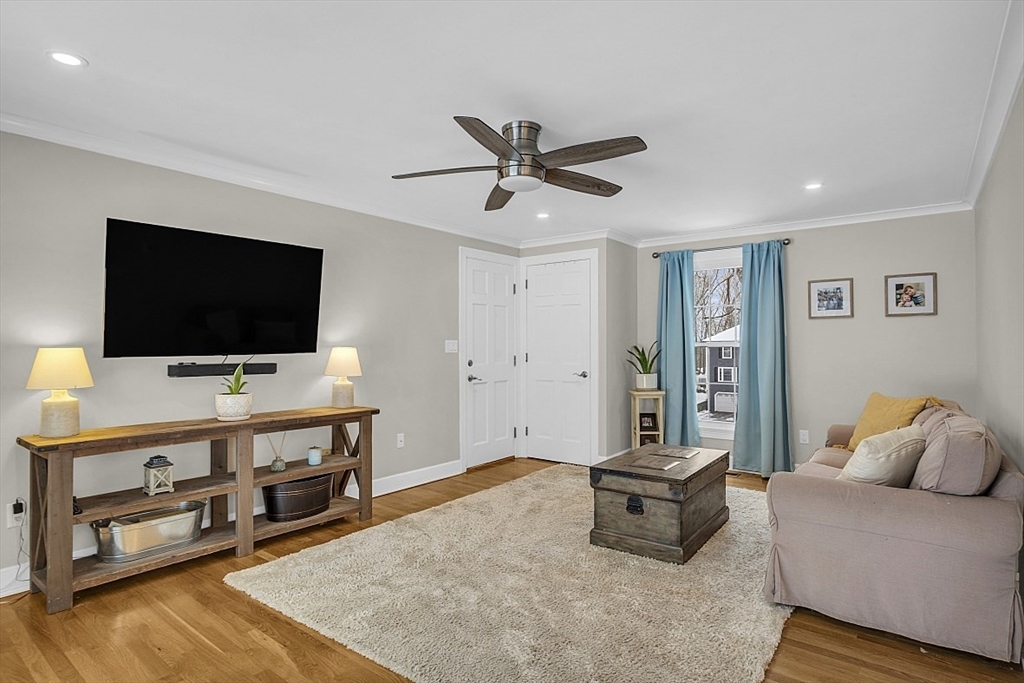 2 Greenbriar Circle Andover, MA 01810 - Photo 12 of 41 a living room with furniture and a flat screen tv