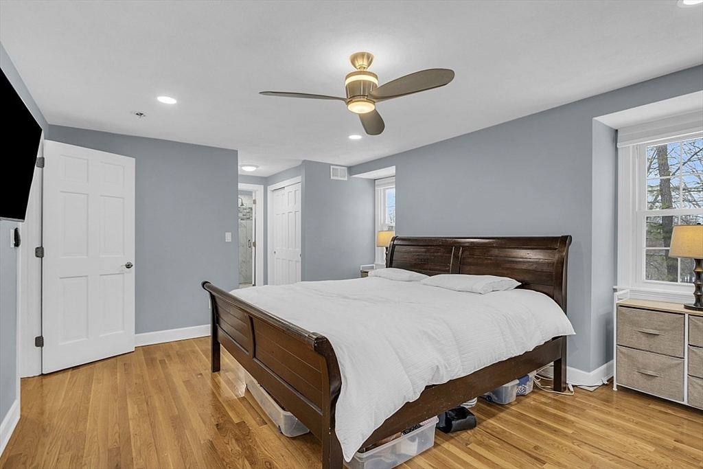 2 Greenbriar Circle Andover, MA 01810 - Photo 20 of 41 a bedroom with a bed and wooden floor
