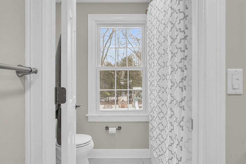 2 Greenbriar Circle Andover, MA 01810 - Photo 32 of 41 a bathroom with a toilet and a shower curtain