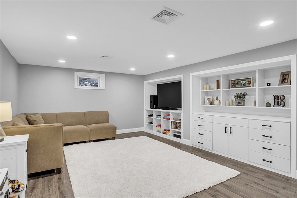 2 Greenbriar Circle Andover, MA 01810 - Photo 33 of 41 a living room with furniture and a flat screen tv