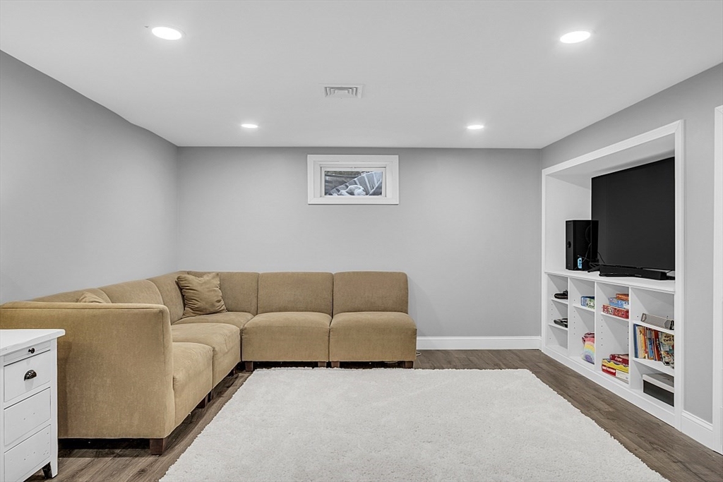2 Greenbriar Circle Andover, MA 01810 - Photo 34 of 41 a living room with furniture and a flat screen tv