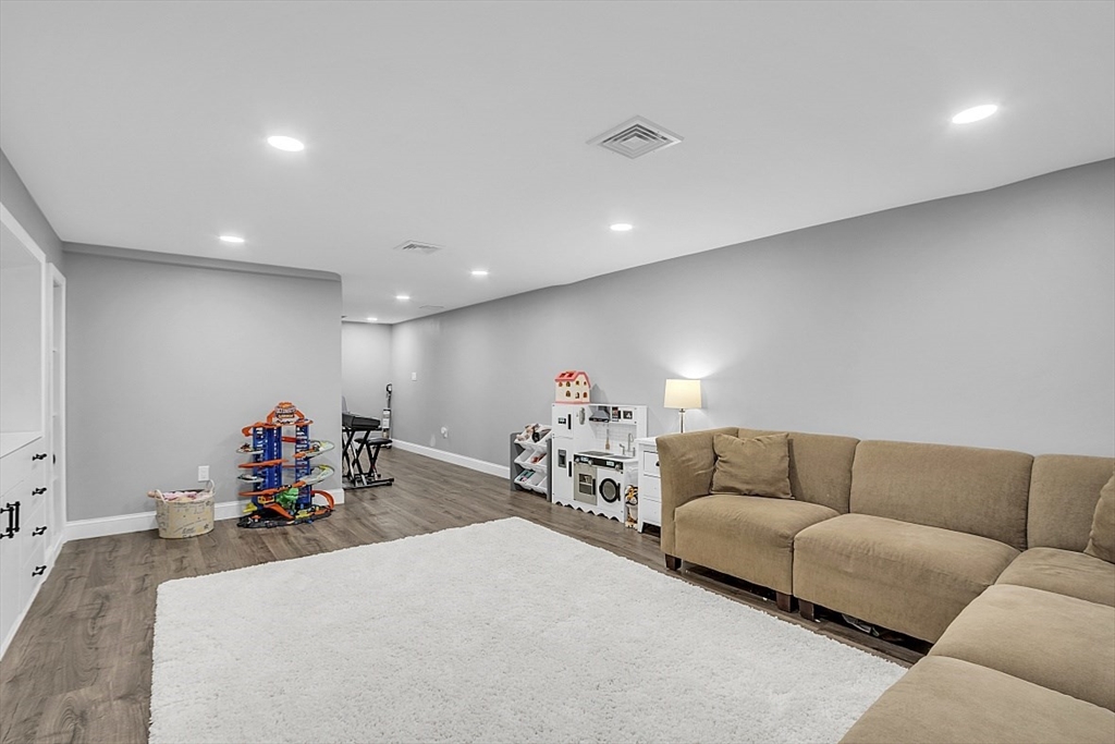2 Greenbriar Circle Andover, MA 01810 - Photo 35 of 41 a living room with furniture and a chandelier