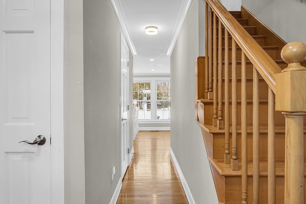 2 Greenbriar Circle Andover, MA 01810 - Photo 5 of 41 a view of a hallway with wooden floor and staircase