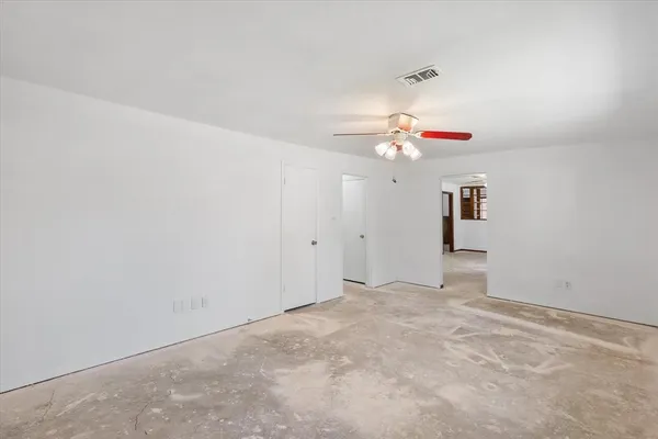 a view of a chandelier fan in a room
