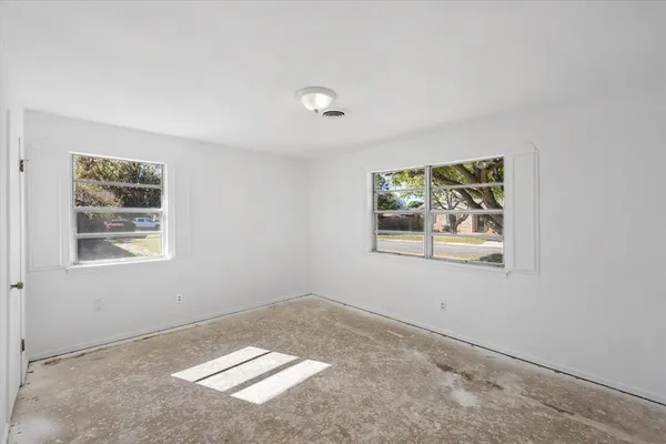 an empty room with windows