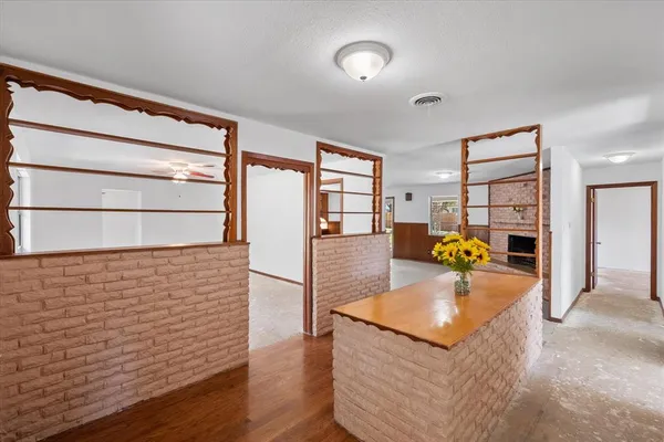 a view of a kitchen with a sink and cabinets