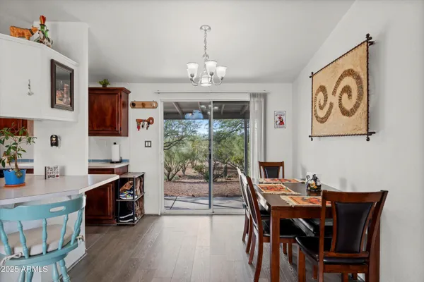 a kitchen with stainless steel appliances granite countertop a sink dishwasher and cabinets with wooden floor