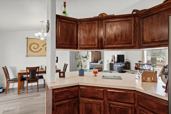 a kitchen with refrigerator a sink and cabinets