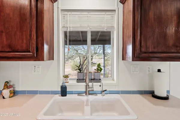 a bedroom with a bed window and a table