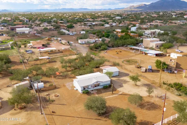 an aerial view of residential houses with outdoor space