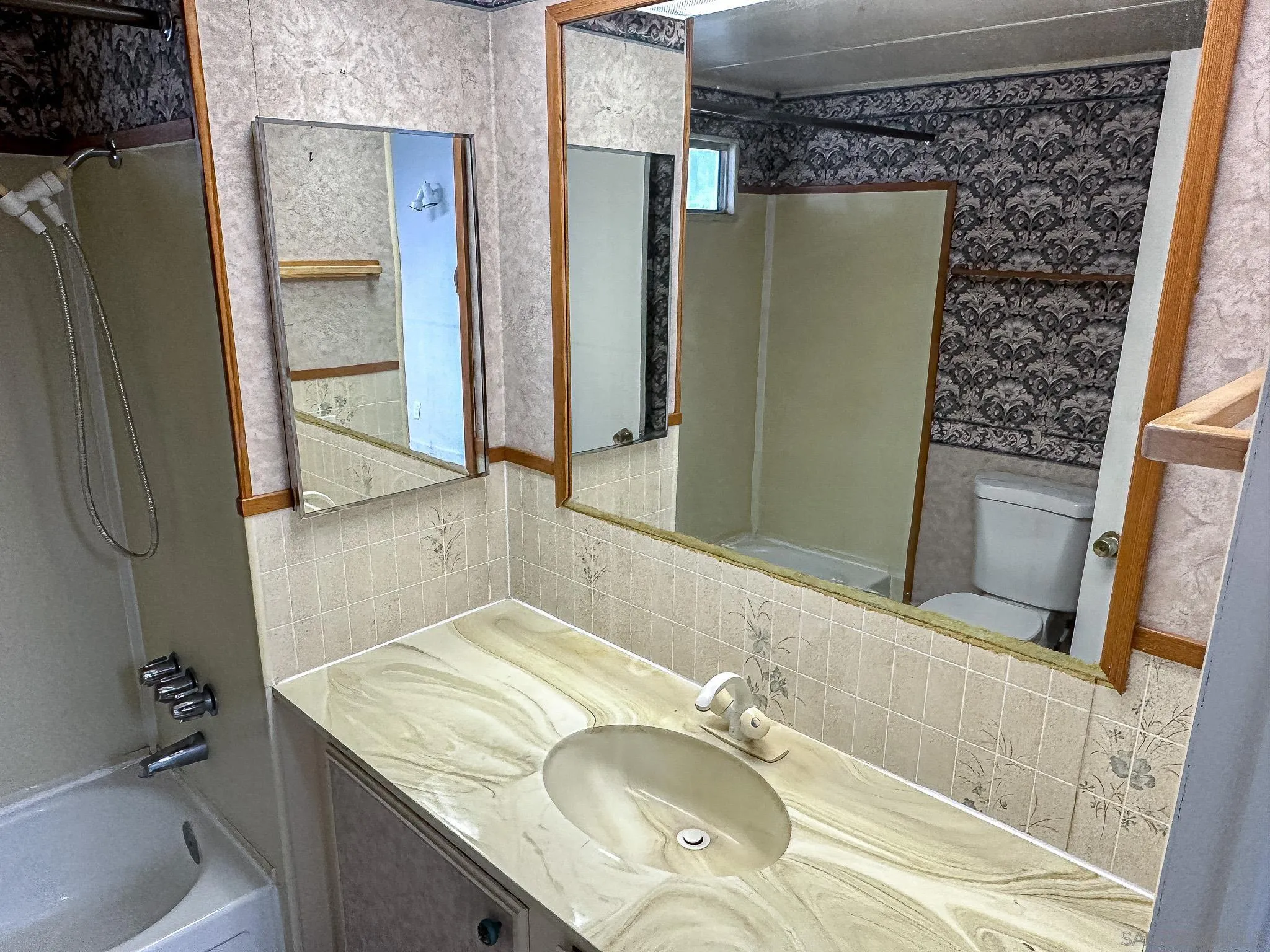 2400 Alpine Boulevard, Unit 17 Alpine, CA 91901 - Photo 12 of 22 a bathroom with a granite countertop sink and a mirror