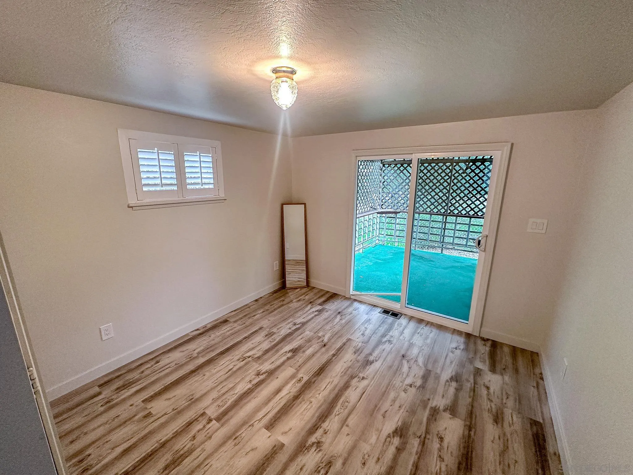 2400 Alpine Boulevard, Unit 17 Alpine, CA 91901 - Photo 13 of 22 a view of an empty room with a window