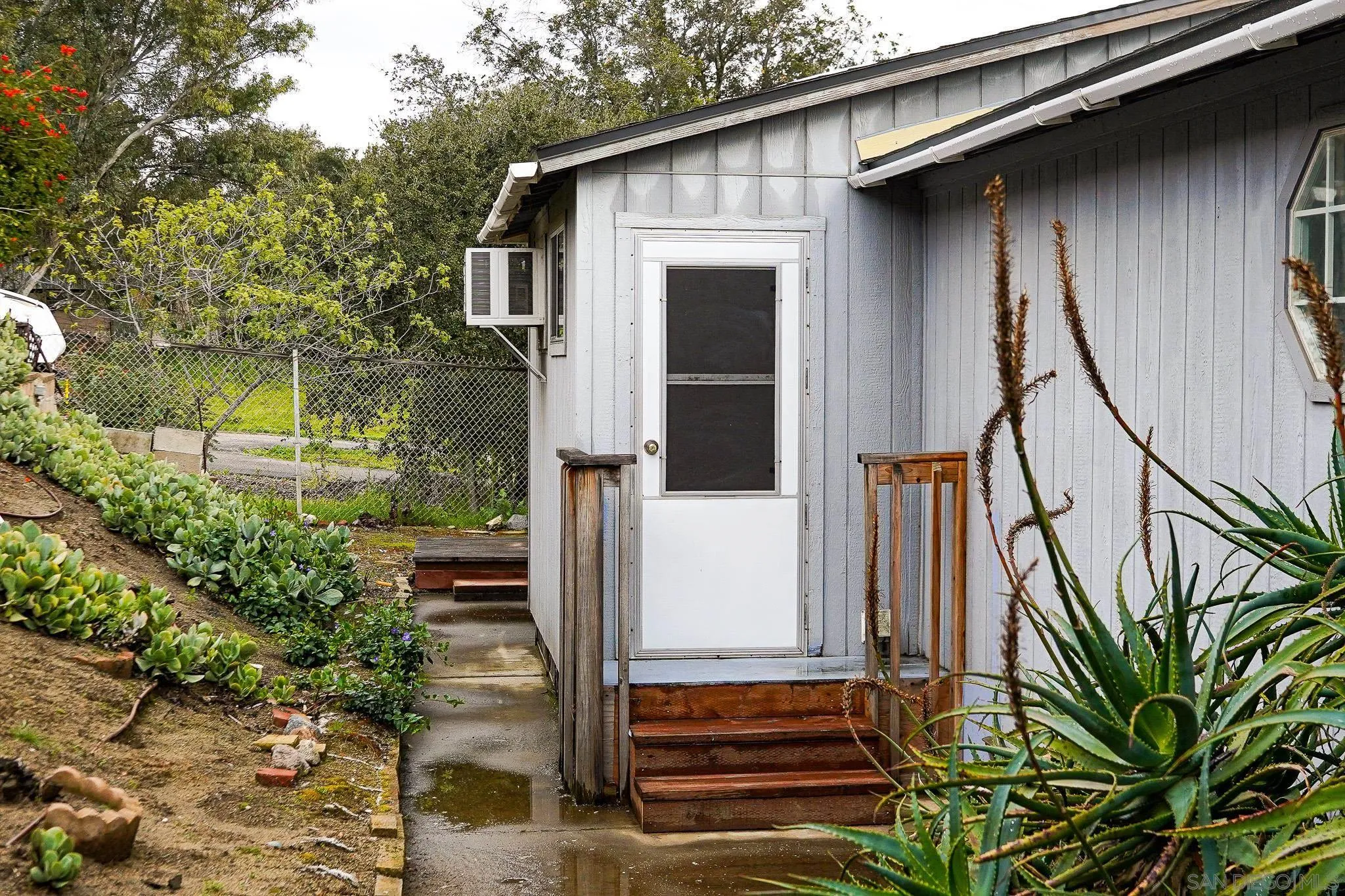 2400 Alpine Boulevard, Unit 17 Alpine, CA 91901 - Photo 22 of 22 a front view of a house with a yard