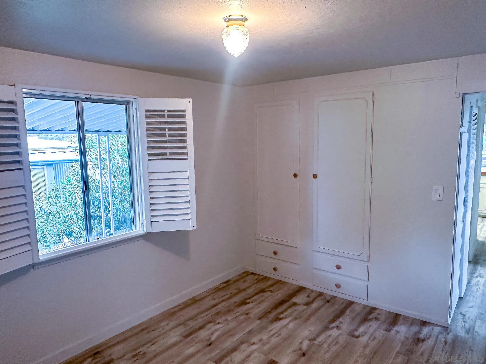 2400 Alpine Boulevard, Unit 17 Alpine, CA 91901 - Photo 10 of 22 a view of an empty room with a window