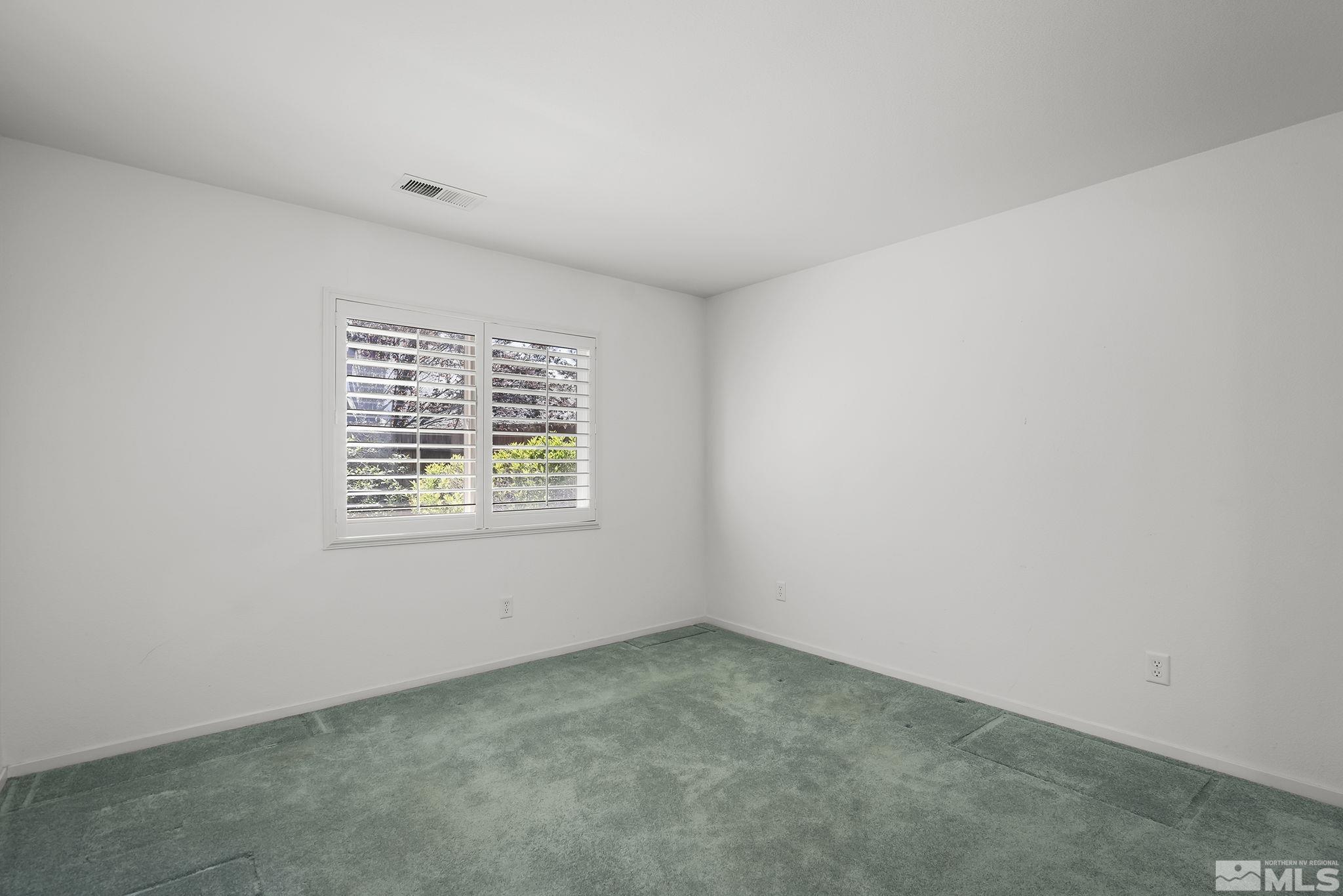 1095 Conifer Drive Minden, NV 89423 - Photo 11 of 19 an empty room with a window