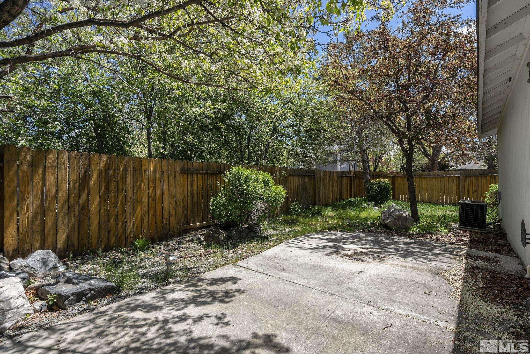 1095 Conifer Drive Minden, NV 89423 - Photo 14 of 19 a backyard of a house with lots of green space