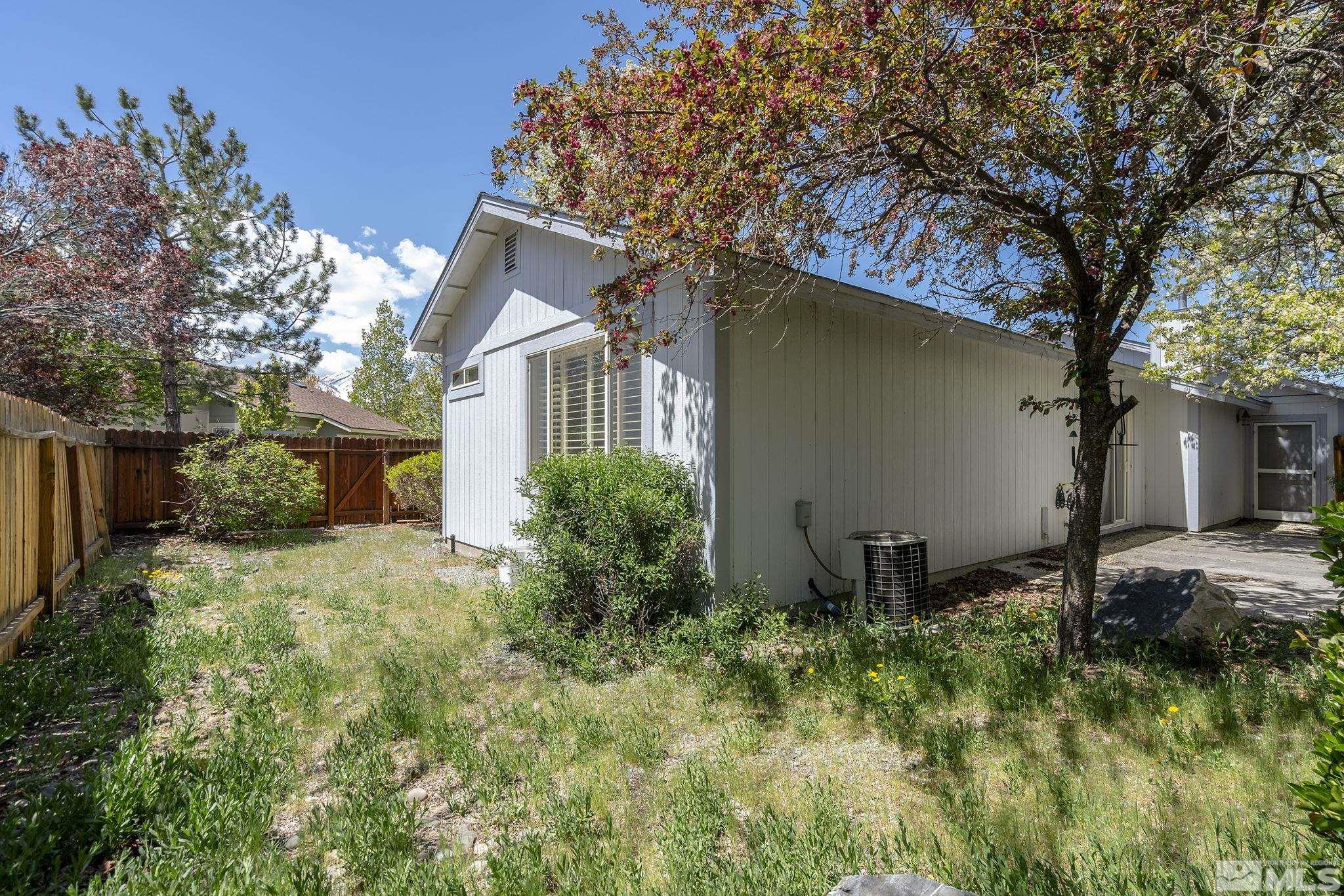 1095 Conifer Drive Minden, NV 89423 - Photo 16 of 19 a front view of a house with garden