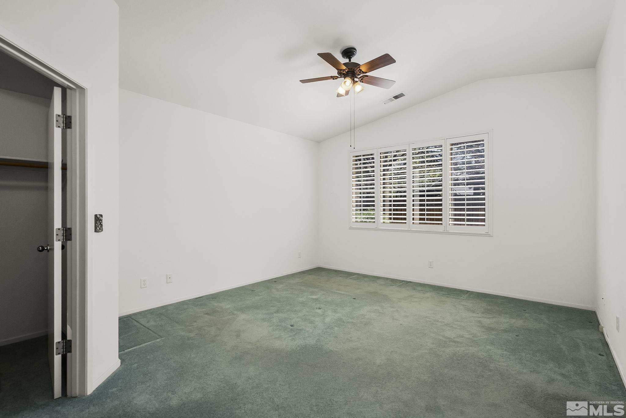 1095 Conifer Drive Minden, NV 89423 - Photo 9 of 19 a view of an empty room with a window