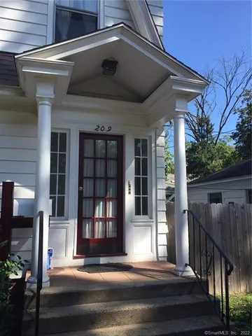 a front view of a house with a porch