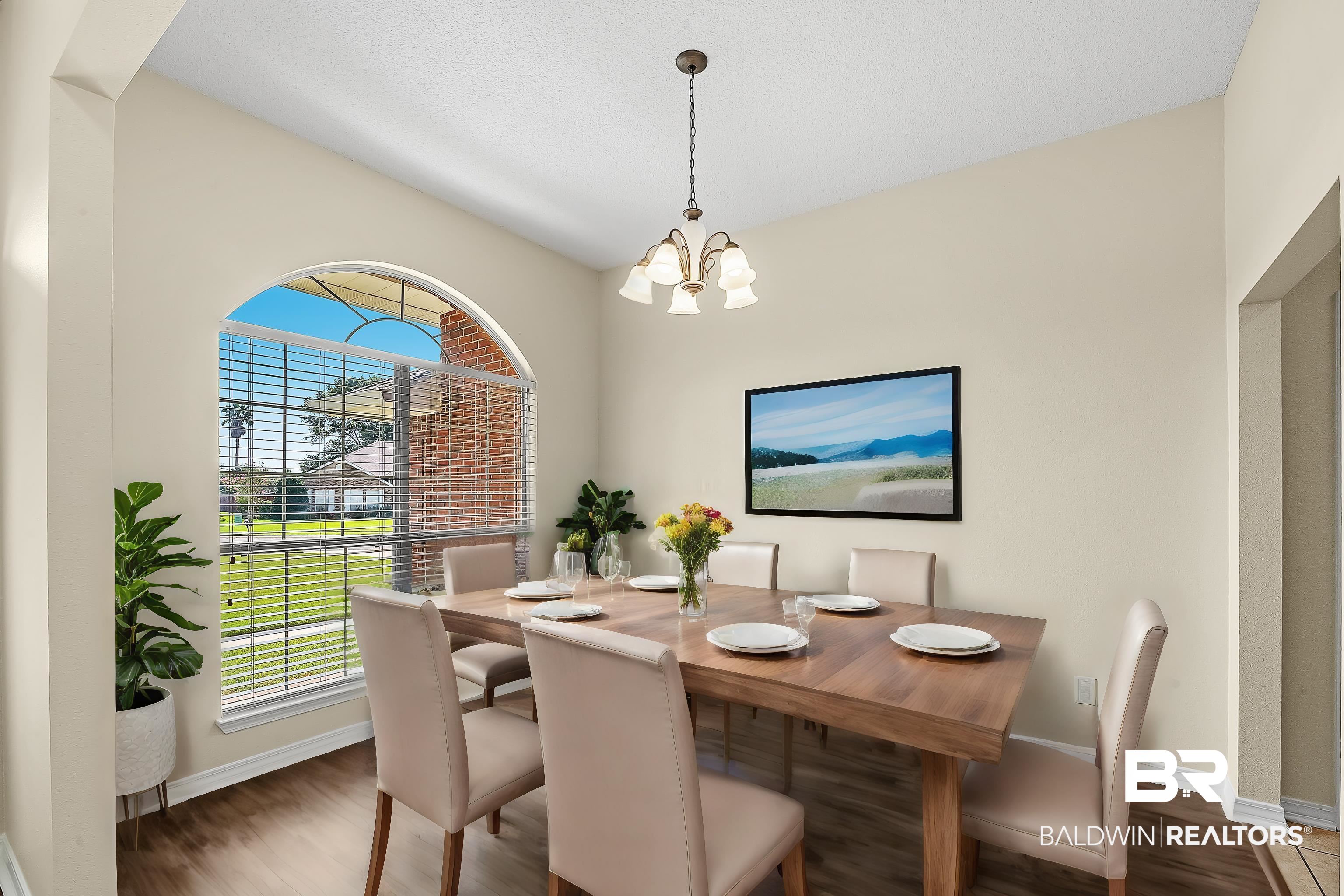 12443 Venice Boulevard Foley, AL 36535 - Photo 15 of 59 Dining space with a textured ceiling, a chandelier, and dark hardwood / wood-style floors