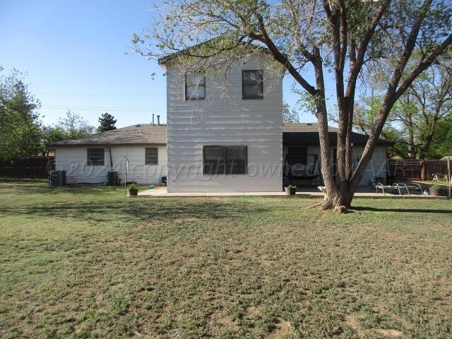 4243 Camp Lane Amarillo, TX 79110 - Photo 17 of 17 a front view of a house with garden