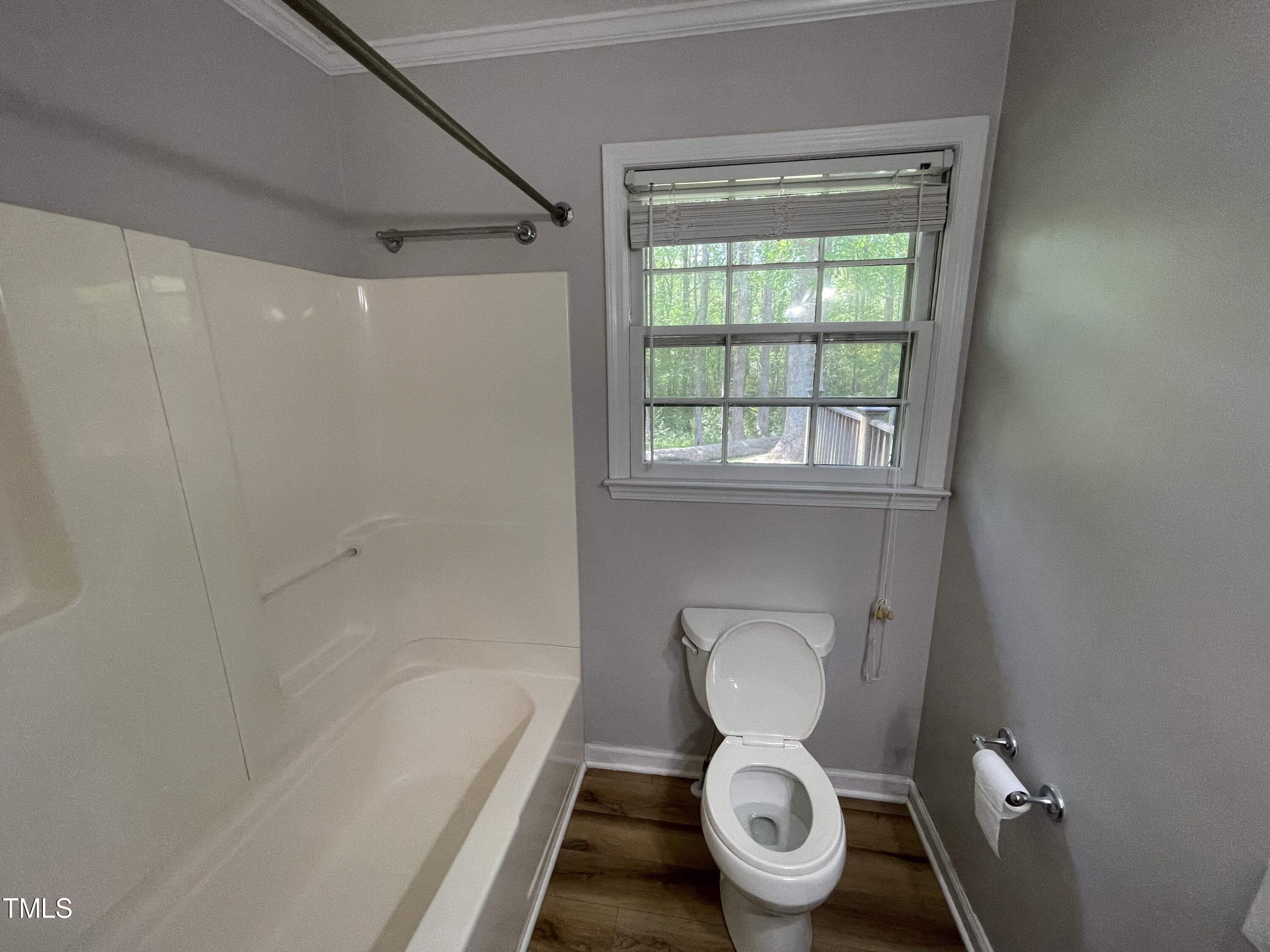 6011 Benson Hardee Road Benson, NC 27504 - Photo 29 of 49 a white toilet sitting next to a bath tub