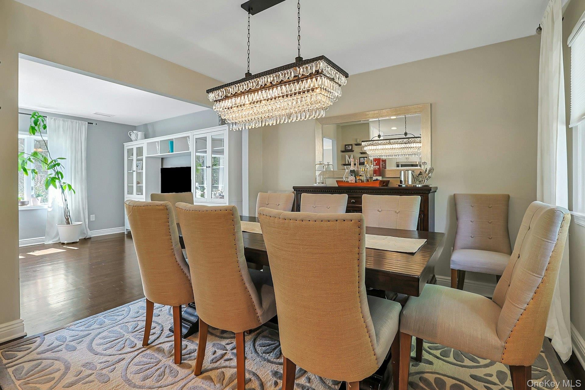 9 Stonegate Road Valhalla, NY 10595 - Photo 17 of 42 Dining area with a tiered crystal chandelier, recessed lighting, and hardwood flooring
