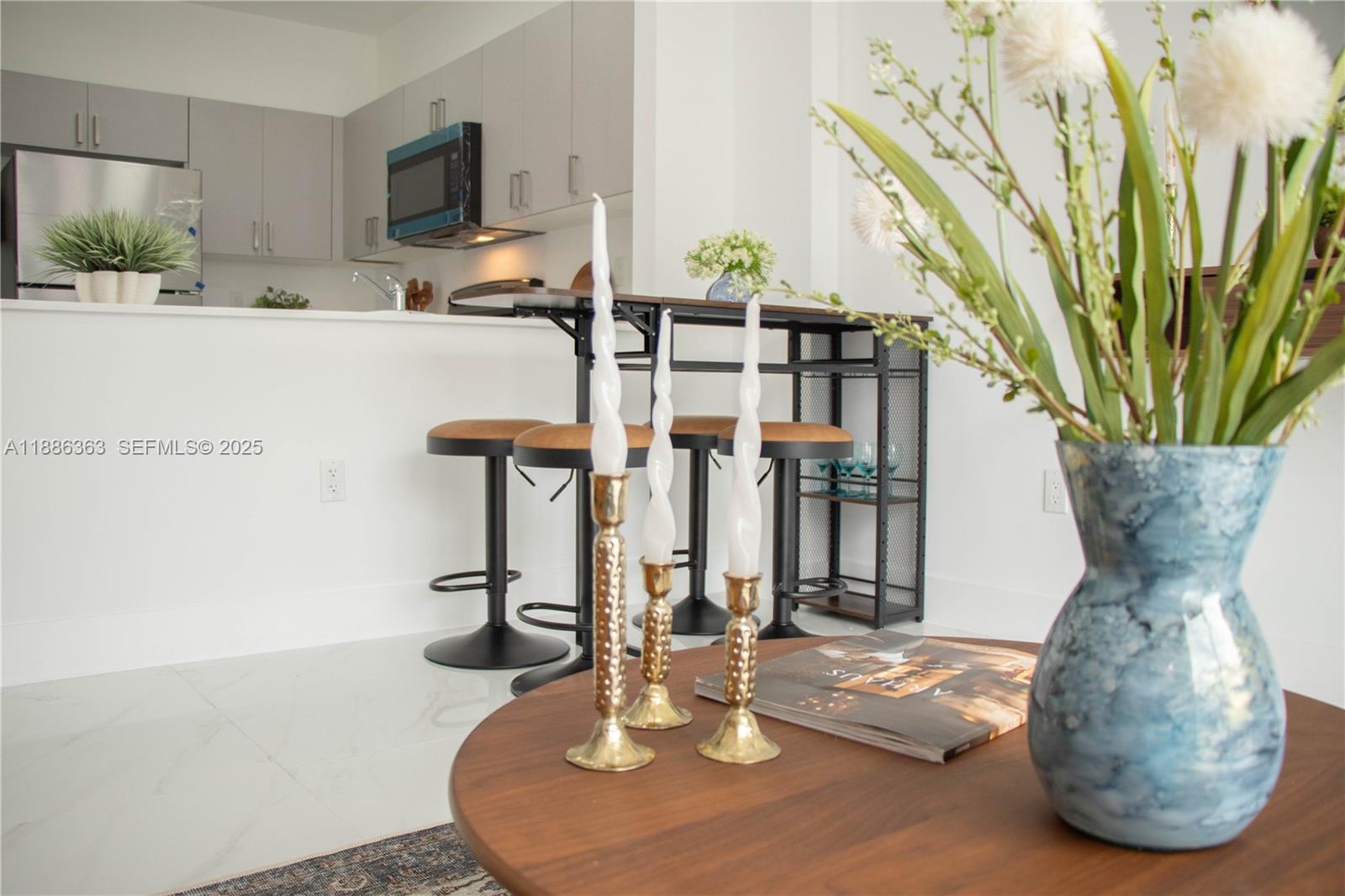1451 West 29th Street, Unit 206 Hialeah, FL 33012 - Photo 17 of 19 a view of a dining room with furniture